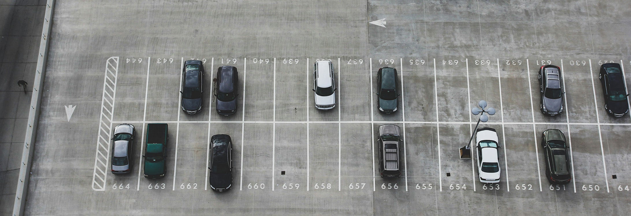 Photo of parked cars by John Matychuk via Unsplash.